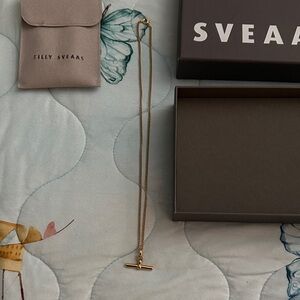 Gold T-Bar On Fine Curb Chain